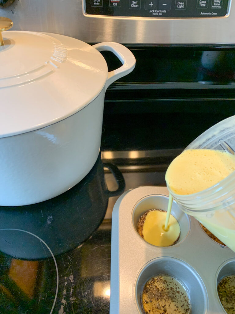 pouring dutch pancake batter in muffin tin