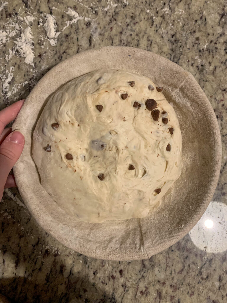 Chocolate chip sourdough bread in banneton basket