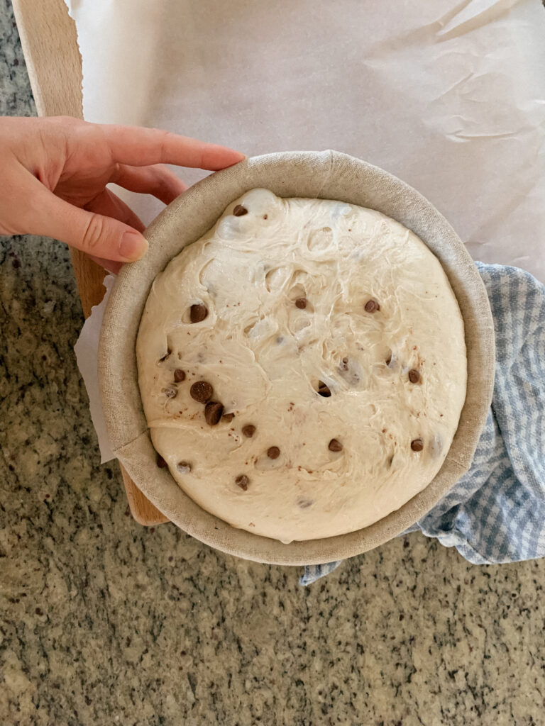 Chocolate chip sourdough bread on counter with blue cloth