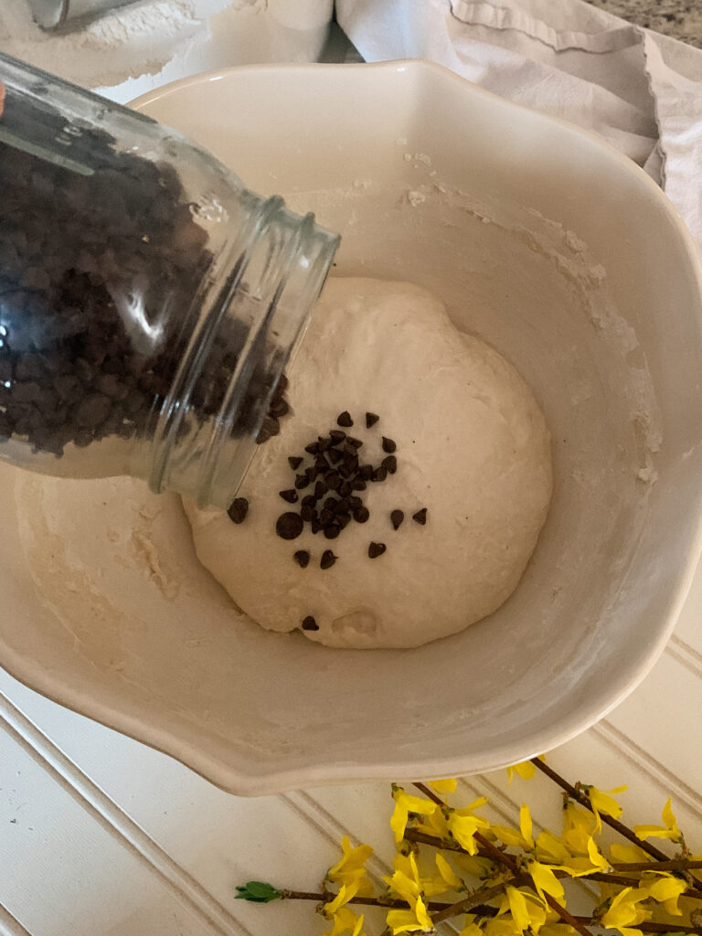 Chocolate Chips being added to sourdough bread