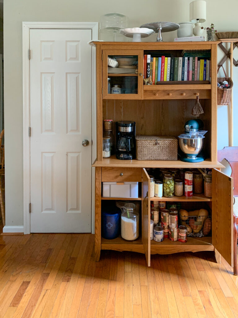 hutch pantry with can goods inside