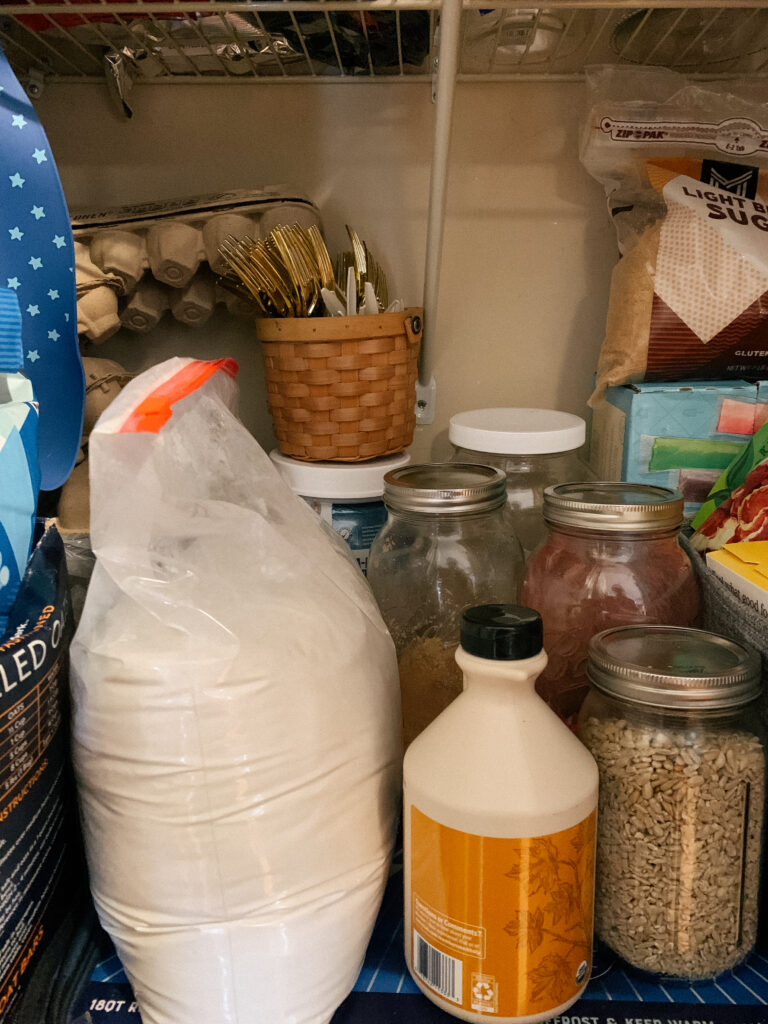 Pantry with jars of flour and dried strawberries