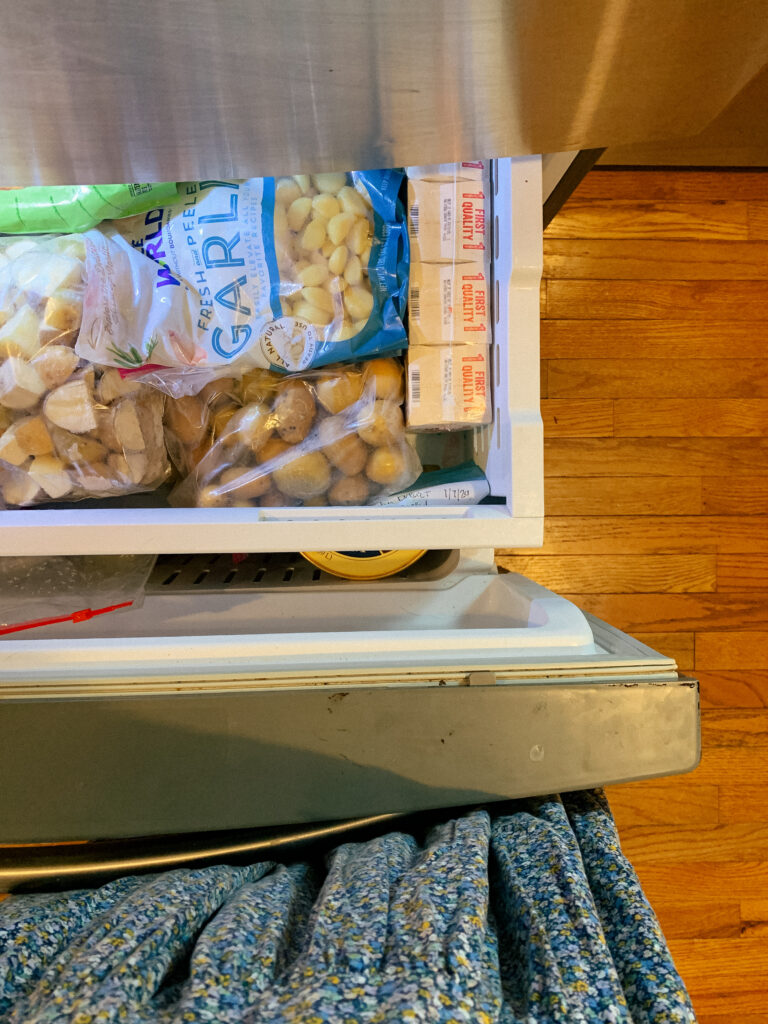 frozen garlic and frozen potatoes in freezer
